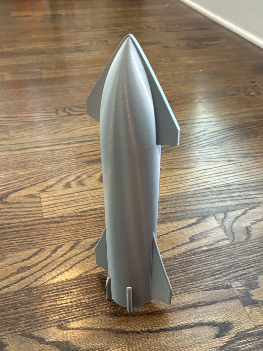 Silver 3D-printed starship-style rocket model